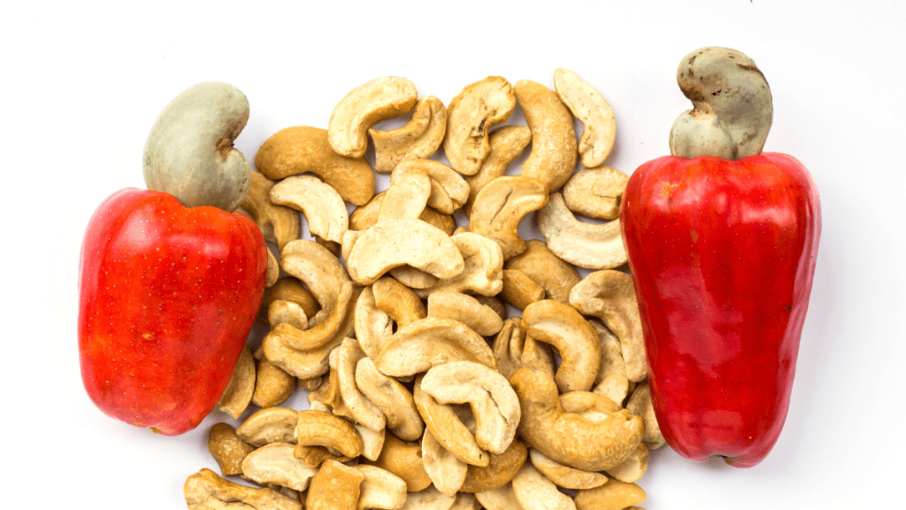 cashew apples with cashews out of the shell